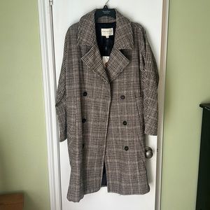 Gorgeous trench coat. Perfect for winter. Brand new with tags. Size small